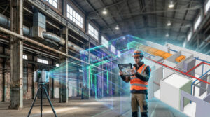 Un technicien utilise une tablette pour visualiser une maquette BIM superposée à un entrepôt scanné par laser.